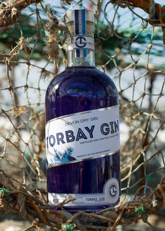 Colour changing torbay gin on net at the beach