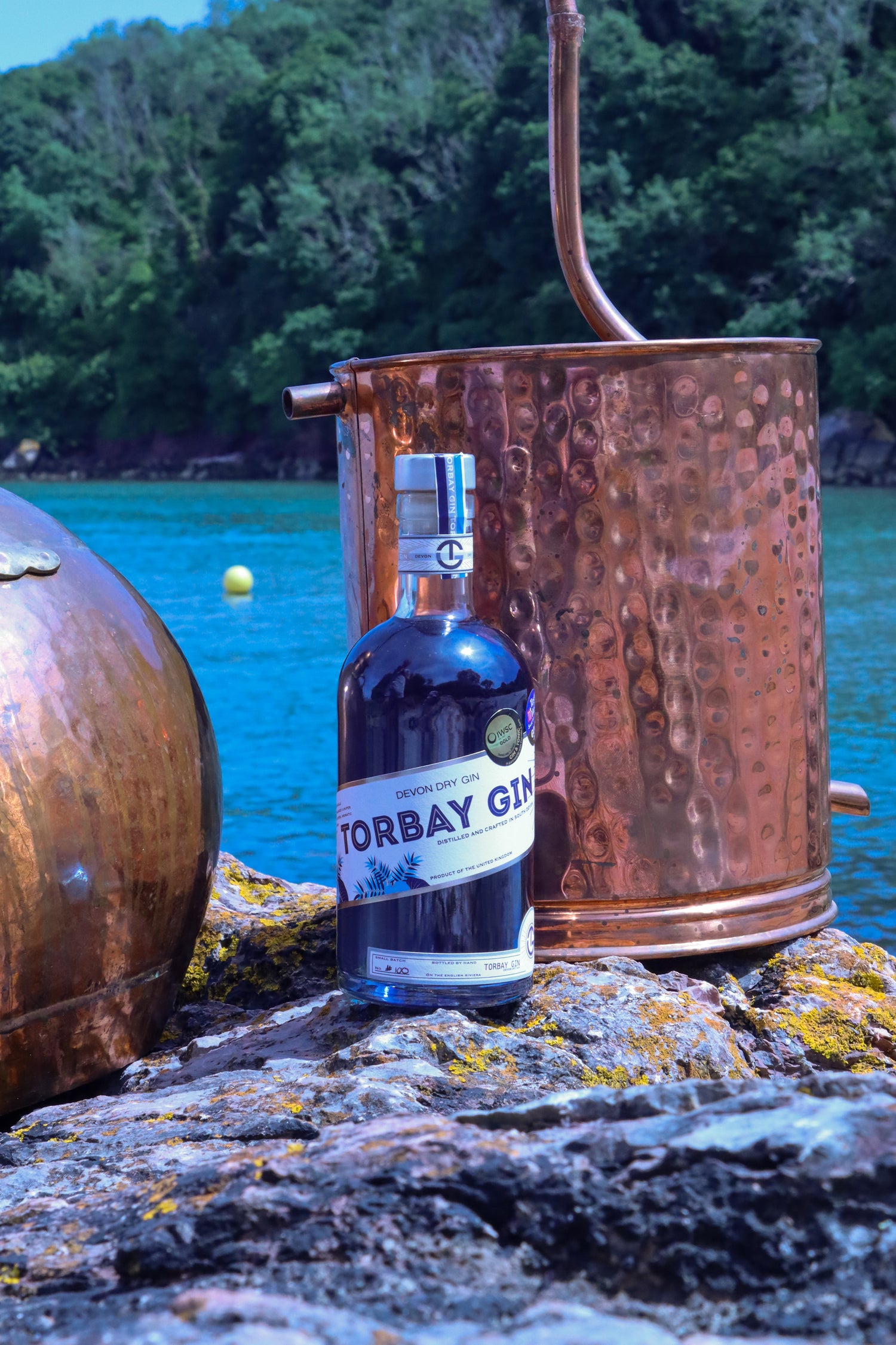 Torbay Gin with gin still at elberry cove in torquay