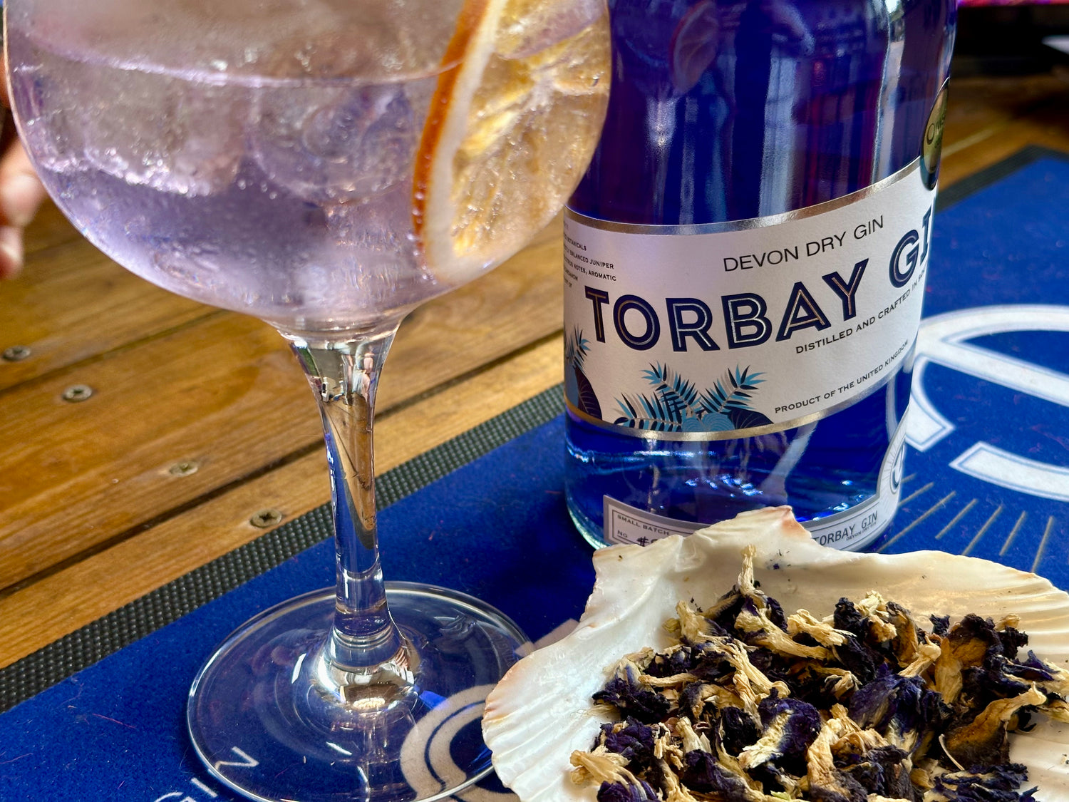 Bottle of torbay Gin with butterfly pea flower and colour changing gin and tonic